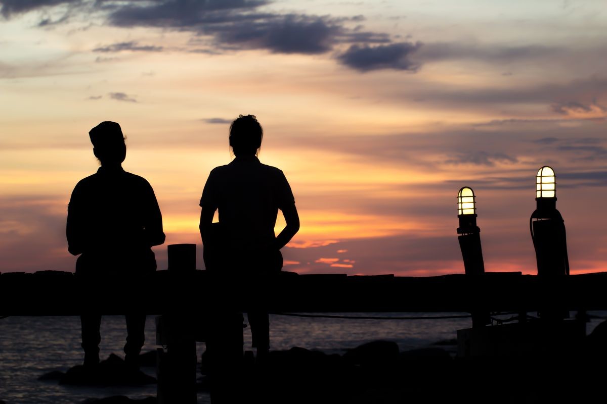 A couple holding hands preparing for a family